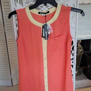 Sleeveless, button down top, AgainstNudity.com